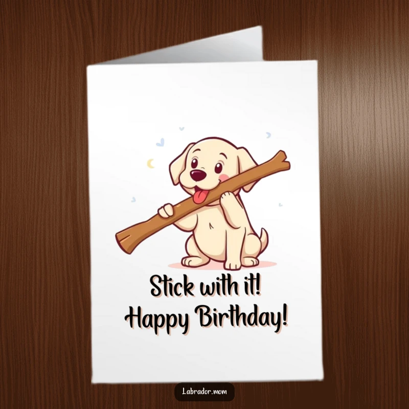 Funny free printable birthday card: a happy kawaii Labrador puppy smiling widely while carrying an absurdly large stick.