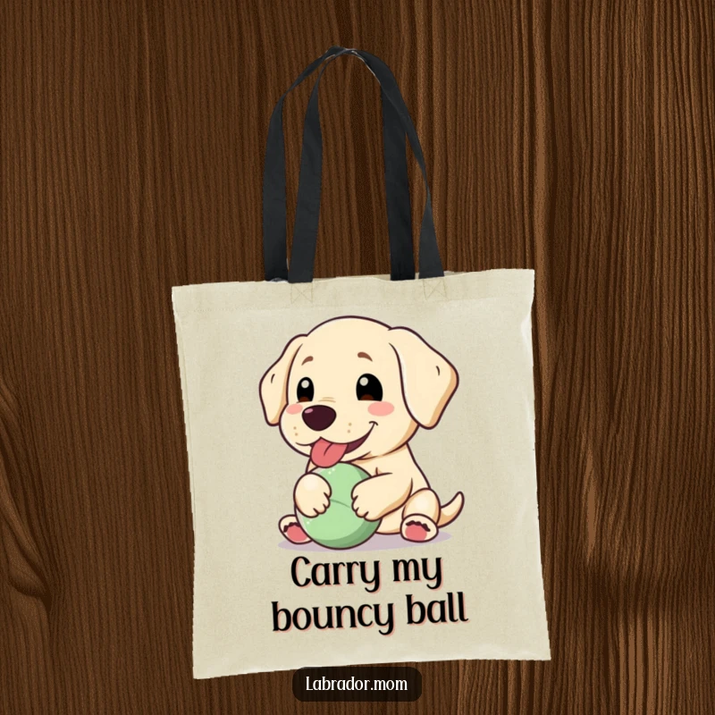 Funny Kawaii Labrador tote bag, a happy dog panting with a floppy ear, holding a ball, perfect for carrying with cheer.